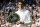 Milos Raonic of Canada holds his runner's up trophy after being beaten by Andy Murray of Britain in the men's singles final on day fourteen of the Wimbledon Tennis Championships in London, Sunday, July 10, 2016. (AP Photo/Kirsty Wigglesworth)