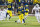 Michigan wide receiver Dennis Norfleet (23) escapes tackles on a kickoff return in the third quarter of an NCAA college football game against Maryland in Ann Arbor, Mich., Saturday, Nov. 22, 2014. The play was nullified due to a Michigan penalty. Maryland won 23-16. (AP Photo/Tony Ding)