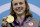 FILE - In this Aug. 3, 2012, file photo, Katie Ledecky, of the United States, poses on the podium with her gold medal for the women's 800-meter freestyle swimming event at the 2012 Summer Olympics in London. Disillusionment. Fear. Rage. In a divided America, the political conventions are sure to arouse those sensations among the millions of viewers tuned in. Then in a commercial break, an electric guitar will blare the final lines of the “The Star-Spangled Banner,” over images of a diverse group of U.S. athletes tearing up as they heard their national anthem during 2012 Olympic medal ceremonies. (AP Photo/Michael Sohn, File)