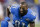 In this Sunday, Dec. 27, 2015 photo, Detroit Lions wide receiver Calvin Johnson (81) warms ups before an NFL football game against the San Francisco 49ers at Ford Field in Detroit. Johnson says NFL players could get painkillers like they were
