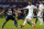 Paris Saint-Germain's Brazilian midfielder Lucas Moura (L) and Defender Marquinhos (C-Back) defend against Real Madrid's French striker Karim Benzema (R) during their friendly football match at the Aspire Academy of Sports Excellence in the Qatari capital Doha on January 2, 2014. Real Madrid won 1-0. AFP PHOTO/AL-WATAN DOHA/KARIM JAAFAR == QATAR OUT ==        (Photo credit should read KARIM JAAFAR/AFP/Getty Images)