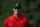 Tiger Woods stands on the 18th green during a trophy ceremony for Quicken Loans National PGA golf tournament winner Billy Hurley III, Sunday, June 26, 2016, in Bethesda, Md. (AP Photo/Patrick Semansky)