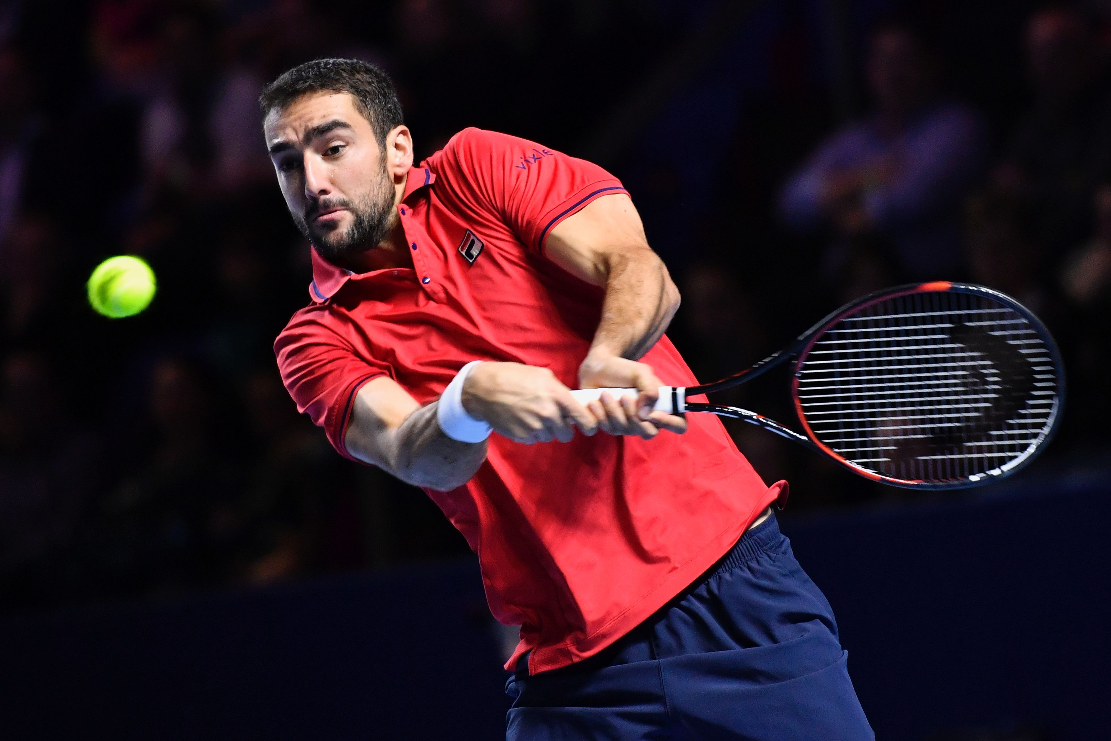 Croatia's Marin Cilic returns a ball to Japan's Kei Nishikori during their final match at the Swiss Indoors ATP 500 tennis tournament on October 30, 2016 in Basel. / AFP / FABRICE COFFRINI (Photo credit should read FABRICE COFFRINI/AFP/Getty Images)