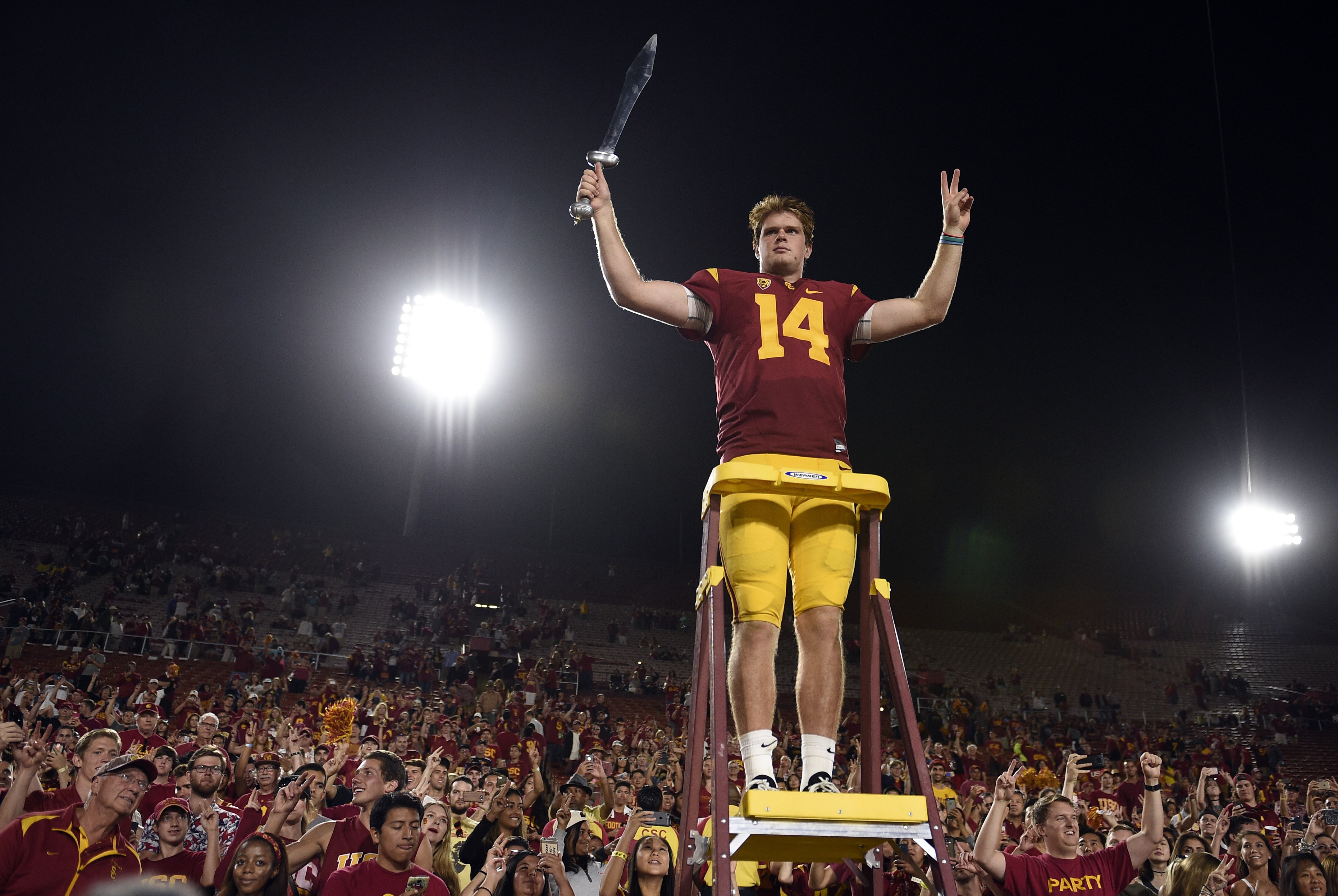 Oct 1, 2016; Los Angeles, CA, USA; Southern California Trojans quarterback Sam Darnold (14) celebrates with the student section after the game against the Arizona State Sun Devils at Los Angeles Memorial Coliseum. The Southern California Trojans won 41-20. Mandatory Credit: Kelvin Kuo-USA TODAY Sports
