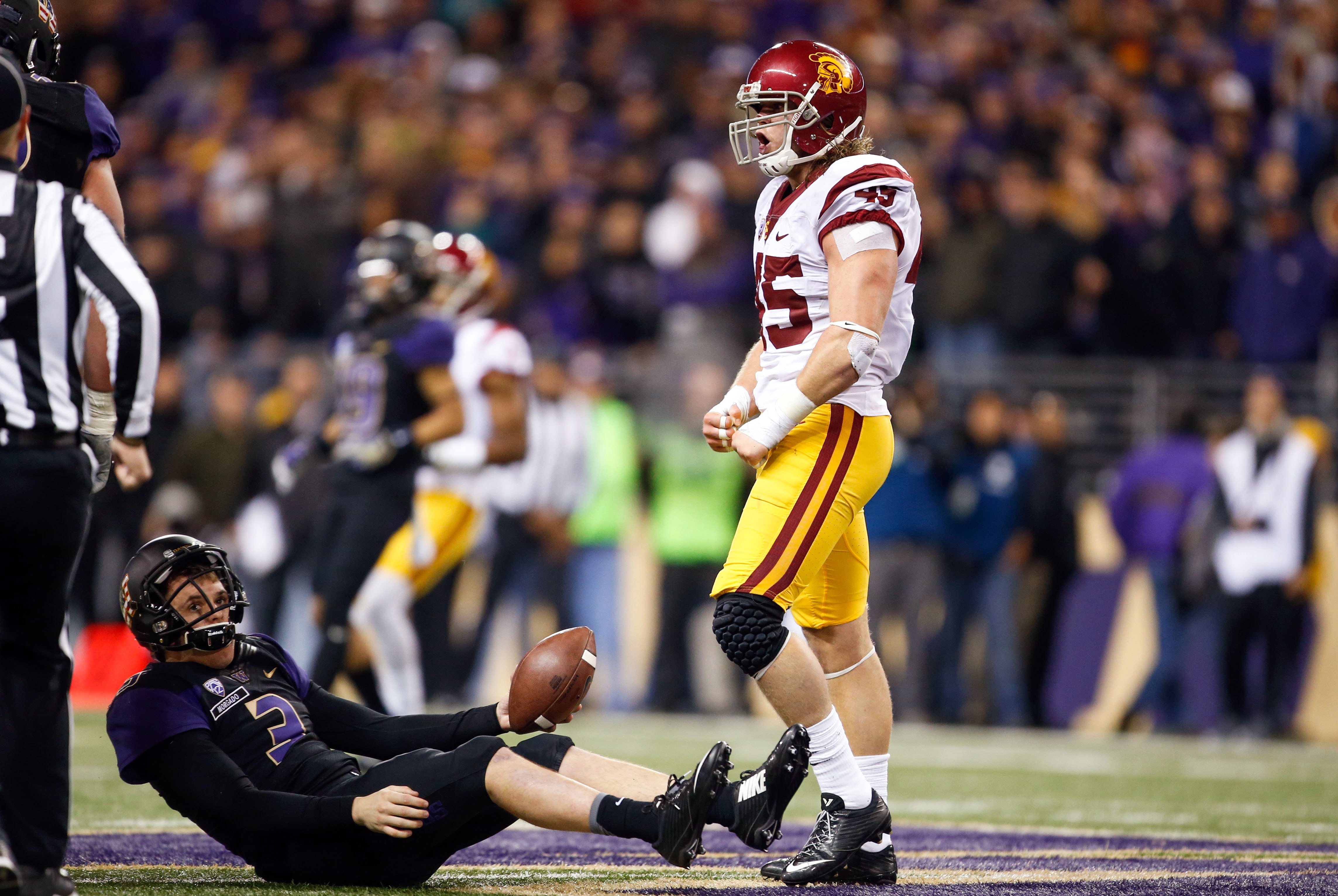 Nov 12, 2016; Seattle, WA, USA; USC Trojans defensive end Porter Gustin (45) celebrates after sacking Washington Huskies quarterback Jake Browning (3) during the fourth quarter at Husky Stadium. Mandatory Credit: Joe Nicholson-USA TODAY Sports