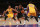 LOS ANGELES, CA - JANUARY 22: Kawhi Leonard #2 of the San Antonio Spurs dribbles to the basket against D'Angelo Russell #1 and Julius Randle #30 of the Los Angeles Lakers in the second half during the NBA game at Staples Center on January 22, 2016 in Los Angeles, California. The Spurs defeated the Lakers 108 - 95. NOTE TO USER: User expressly acknowledges and agrees that, by downloading and or using this photograph, User is consenting to the terms and conditions of the Getty Images License Agreement.  (Photo by Victor Decolongon/Getty Images)