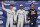 Mercedes AMG Petronas F1 Team's British driver Lewis Hamilton (C), flanked by his German teammate Nico Rosberg (L) and Infiniti Red Bull Racing's Australian driver Daniel Ricciardo, celebrate at the end of the qualifying session as part of the Abu Dhabi Formula One Grand Prix at the Yas Marina circuit on November 26, 2016.
Lewis Hamilton will start on pole for the Abu Dhabi Grand Prix title showdown after the defending champion bettered his Mercedes teammate Nico Rosberg in qualifying. Red Bull's Daniel Ricciardo came in third to start on the second row at Yas Marina where the Australian is joined by the Ferrari of Kimi Raikkonen. / AFP / Andrej ISAKOVIC        (Photo credit should read ANDREJ ISAKOVIC/AFP/Getty Images)