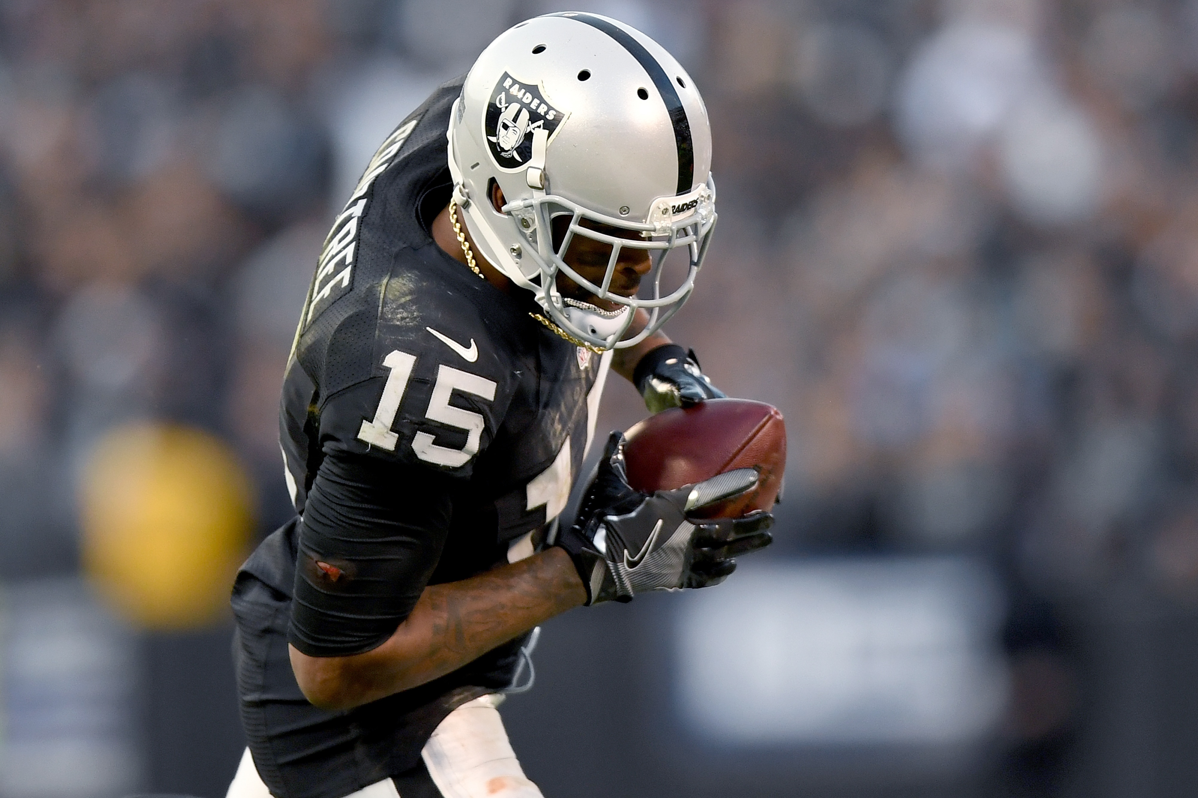 OAKLAND, CA - NOVEMBER 27: Michael Crabtree #15 of the Oakland Raiders catches a pass against the Carolina Panthers during an NFL football game on November 27, 2016 at the Oakland-Alameda County Coliseum in Oakland, California. (Photo by Thearon W. Henderson/Getty Images)