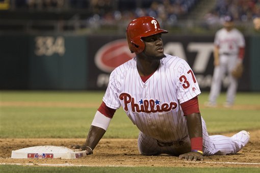 Philadelphia Phillies' Odubel Herrera looks up after sliding back into first base during the sixth inning of a baseball game against the Washington Nationals, Monday, Aug. 29, 2016, in Philadelphia. The Nationals won 4-0. (AP Photo/Chris Szagola)