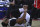 Anthony Davis of the New Orleans Pelicans reacts in pain as he injures his right ankle during a preseasons match against Houston Rockets in Beijing, China, Wednesday, Oct. 12, 2016. Davis fell to the court early in the first quarter of Wednesday's game in Beijing, the last of the NBA's two exhibitions in China. He re-entered the game briefly, but soon walked to the locker room. (AP Photo/Ng Han Guan)