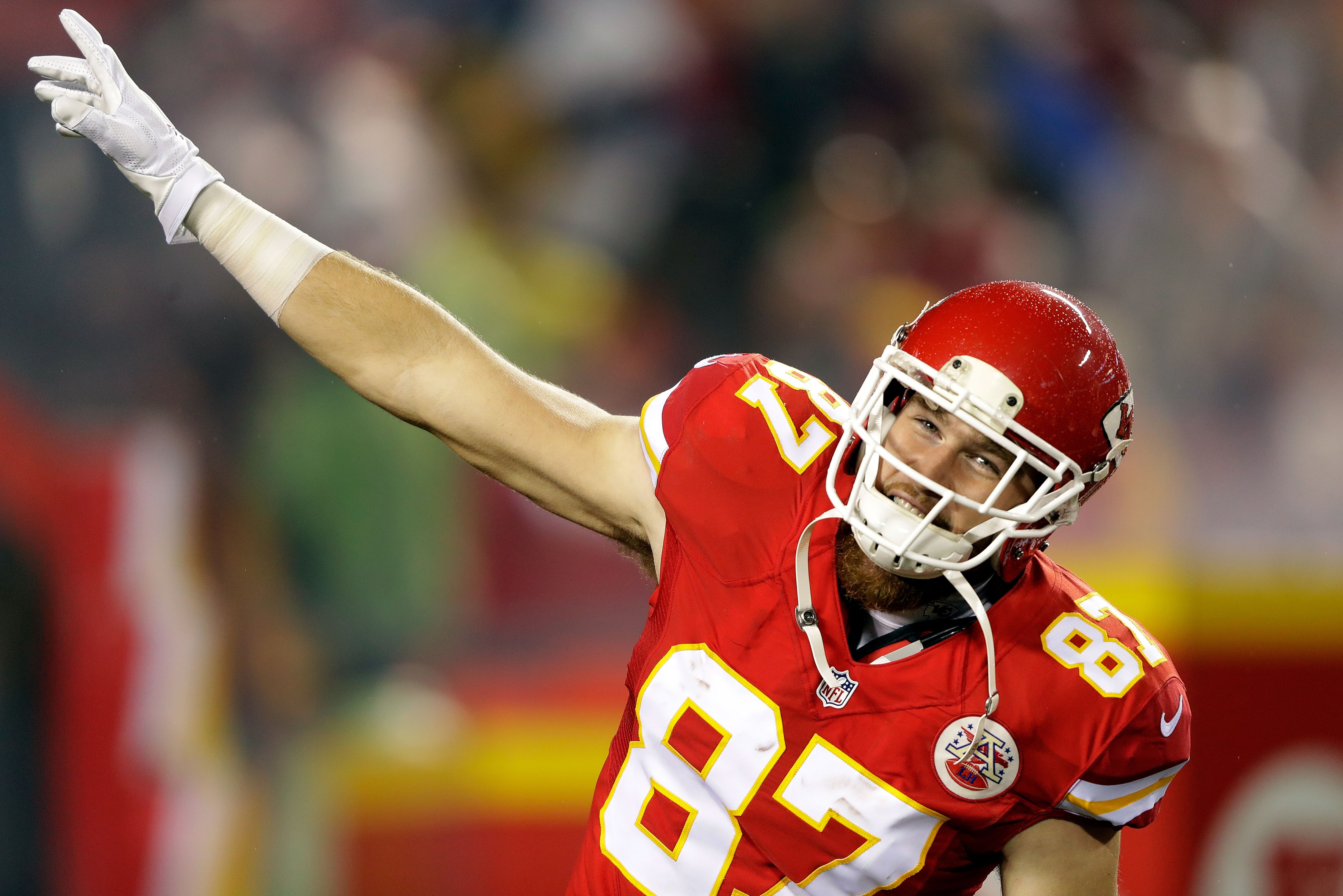 KANSAS CITY, MO - DECEMBER 25: Tight end Travis Kelce #87 of the Kansas City Chiefs enters the field during player introductions prior to the game against the Denver Broncos at Arrowhead Stadium on December 25, 2016 in Kansas City, Missouri. (Photo by Jamie Squire/Getty Images)