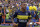 Boca Juniors' forward Carlos Tevez enters the field before their Argentina First Division football match against Colon,  at La Bombonera stadium, in Buenos Aires, on December 18, 2016. / AFP / ALEJANDRO PAGNI        (Photo credit should read ALEJANDRO PAGNI/AFP/Getty Images)