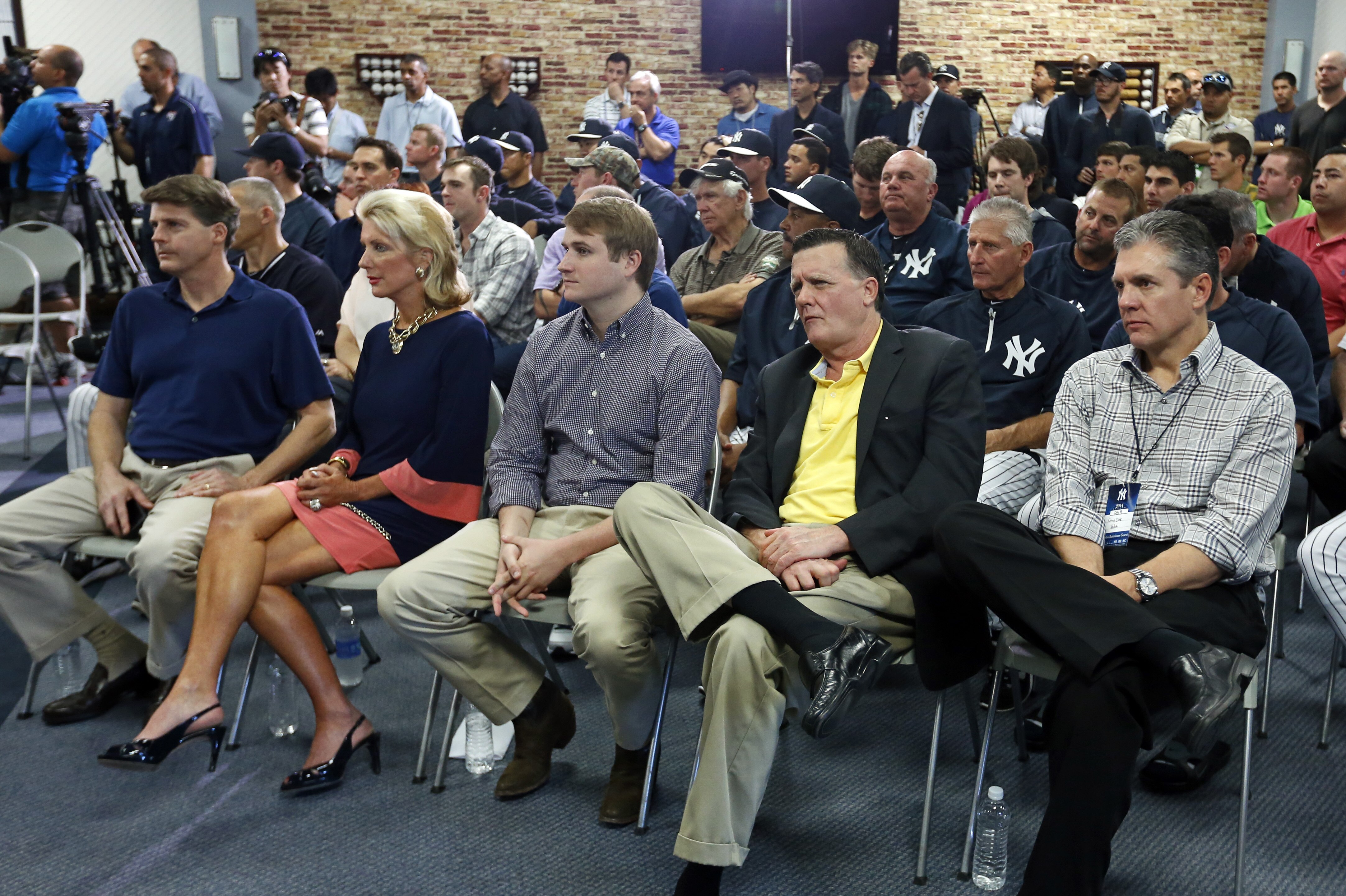 TAMPA, FL - FEBRUARY 19: Members of the New York Yankees management (L-R) Hal Steinbrenner, Jennifer Steinbrenner Swindal, Stephen Swindal Jr., and Hank Steinbrenner are joined by agent Casey Close as they listen to Derek Jeter speaking at a media availability after announcing that the 2014 season will be his last before retiring at George M. Steinbrenner Field on February 19, 2014 in Tampa, Florida. (Photo by Mike Carlson/Getty Images)