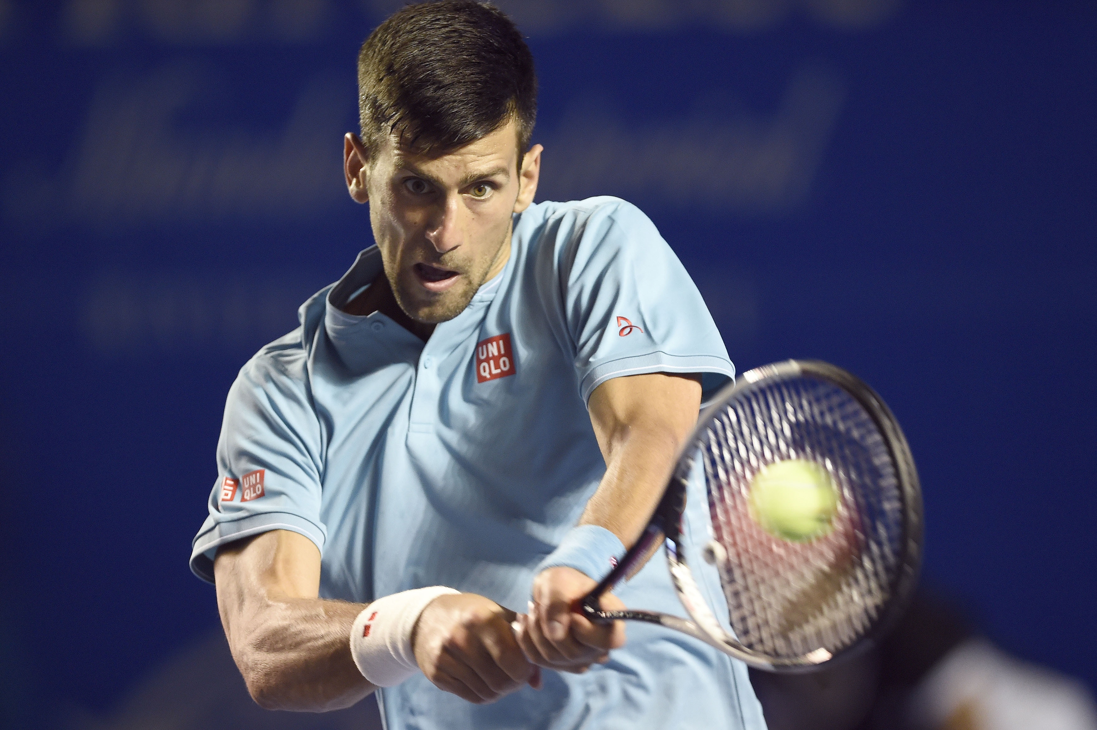 TOPSHOT - Serbia's Novak Djokovic returns the ball to Australia's Nick Kyrgios during the fourth day of the Mexican Tennis Open, in Acapulco, Guerrero State, Mexico, on March 2, 2017. / AFP PHOTO / ALFREDO ESTRELLA        (Photo credit should read ALFREDO ESTRELLA/AFP/Getty Images)
