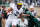 EAST LANSING, MI - OCTOBER 29: Devin Asiasi #2 of the Michigan Wolverines tries to outrun the tackles of Riley Bullough #30 and Ed Davis #43 of the Michigan State Spartans during a first quarter run at Spartan Stadium on October 29, 2016 in East Lansing, Michigan. (Photo by Gregory Shamus/Getty Images)