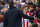 Diego Simeone prepares to shake hands with Atletico Madrid's star striker Antoine Griezmann.