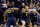INDIANAPOLIS, IN - MARCH 19:  Muhammad-Ali Abdur-Rahkman #12 and D.J. Wilson #5 of the Michigan Wolverines celebrate in the second half against the Louisville Cardinals during the second round of the 2017 NCAA Men's Basketball Tournament at the Bankers Life Fieldhouse on March 19, 2017 in Indianapolis, Indiana. Michigan Wolverines won 73-69.  (Photo by Joe Robbins/Getty Images)