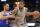 San Antonio Spurs forward LaMarcus Aldridge (12) drives against New York Knicks guard Courtney Lee during the second half of an NBA basketball game, Saturday, March 25, 2017, in San Antonio. (AP Photo/Darren Abate)