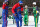 Kris Hi-Lite Bruton, lft, of the Harlem Globetrotters, toys with teammate Kevin Turbo Pearson as they act as quarterback and snapper as they team took on the Washington Generals during a basketball game on the outdoor ice rink at Lasker Rink in New York's Central Park on Tuesday, Feb. 9, 2010. (AP Photo/Craig Ruttle)