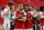 Arsenal's Welsh midfielder Aaron Ramsey (C) and Arsenal's English midfielder Theo Walcott celebrate on the pitch after their win over Chelsea in the English FA Cup final football match between Arsenal and Chelsea at Wembley stadium in London on May 27, 2017.
Aaron Ramsey scored a 79th-minute header to earn Arsenal a stunning 2-1 win over Double-chasing Chelsea on Saturday and deliver embattled manager Arsene Wenger a record seventh FA Cup. / AFP PHOTO / Ian KINGTON / NOT FOR MARKETING OR ADVERTISING USE / RESTRICTED TO EDITORIAL USE        (Photo credit should read IAN KINGTON/AFP/Getty Images)