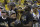 Golden State Warriors forward Draymond Green (23) holds the Larry O'Brien NBA Championship Trophy after Game 5 of basketball's NBA Finals against the Cleveland Cavaliers in Oakland, Calif., Monday, June 12, 2017. The Warriors won 129-120 to win the NBA championship. (AP Photo/Marcio Jose Sanchez)