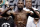 FILE - In this Sept. 12, 2014, file photo, Floyd Mayweather Jr. poses on the scale during a weigh in for a fight against Marcos Maidana in Las Vegas. Mayweather Jr. said Wednesday, June 14, 2017,  he will come out of retirement to face UFC star Conor McGregor in a boxing match on Aug. 26. Mayweather, who retired in September 2015 after winning all 49 of his pro fights, will face a mixed martial arts fighter who has never been in a scheduled 12-round fight at the MGM Grand arena. The fight will take place in a boxing ring and be governed by boxing rules.  (AP Photo/John Locher, File)