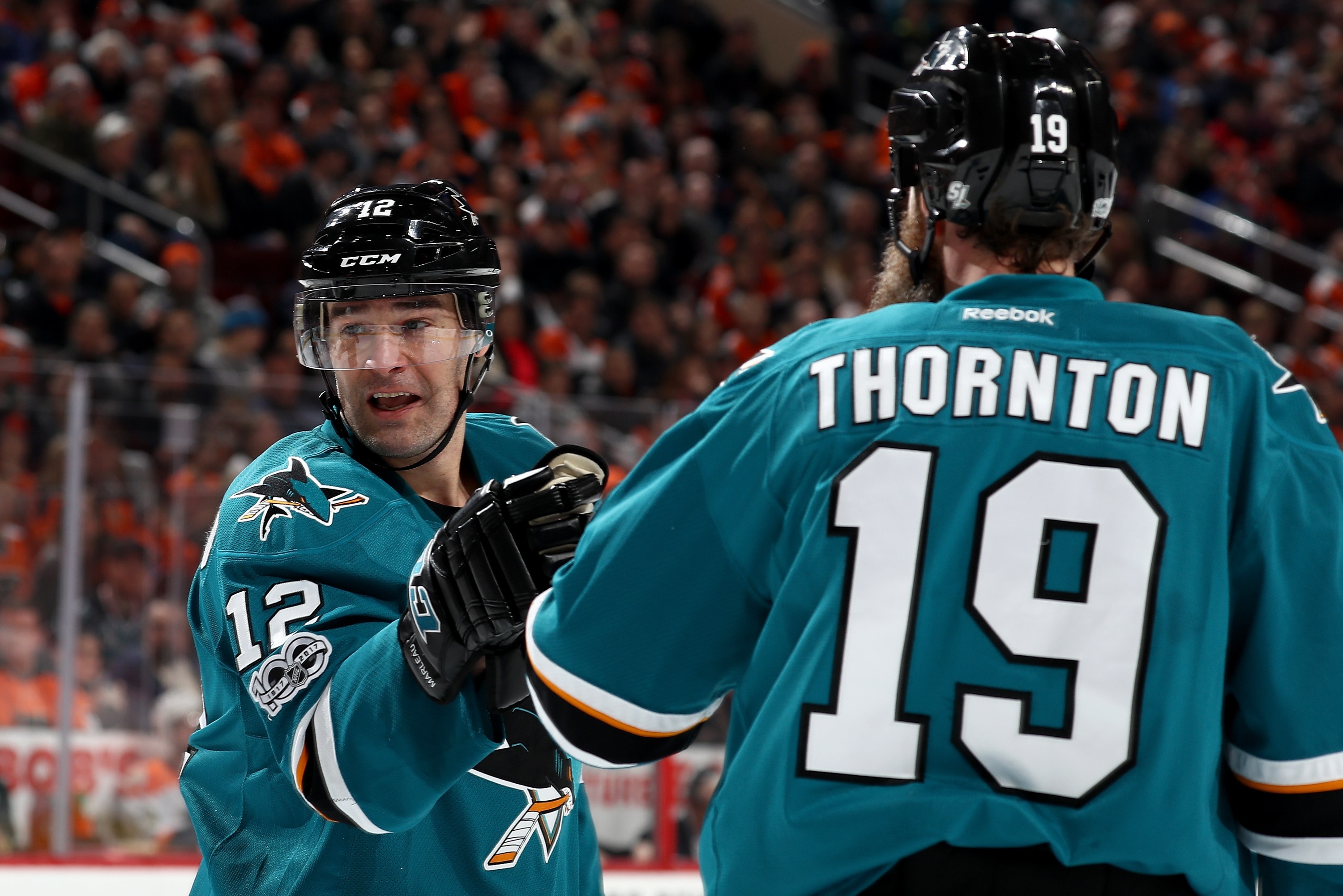 PHILADELPHIA, PA - FEBRUARY 11: Patrick Marleau #12 of the San Jose Sharks is congratulated by teammate Joe Thornton #19 after he scored in the third period against the Philadelphia Flyers on February 11, 2017 at Wells Fargo Center in Philadelphia, Pennsylvania.The Philadelphia Flyers defeated the San Jose Sharks 2-1 in overtime. (Photo by Elsa/Getty Images)