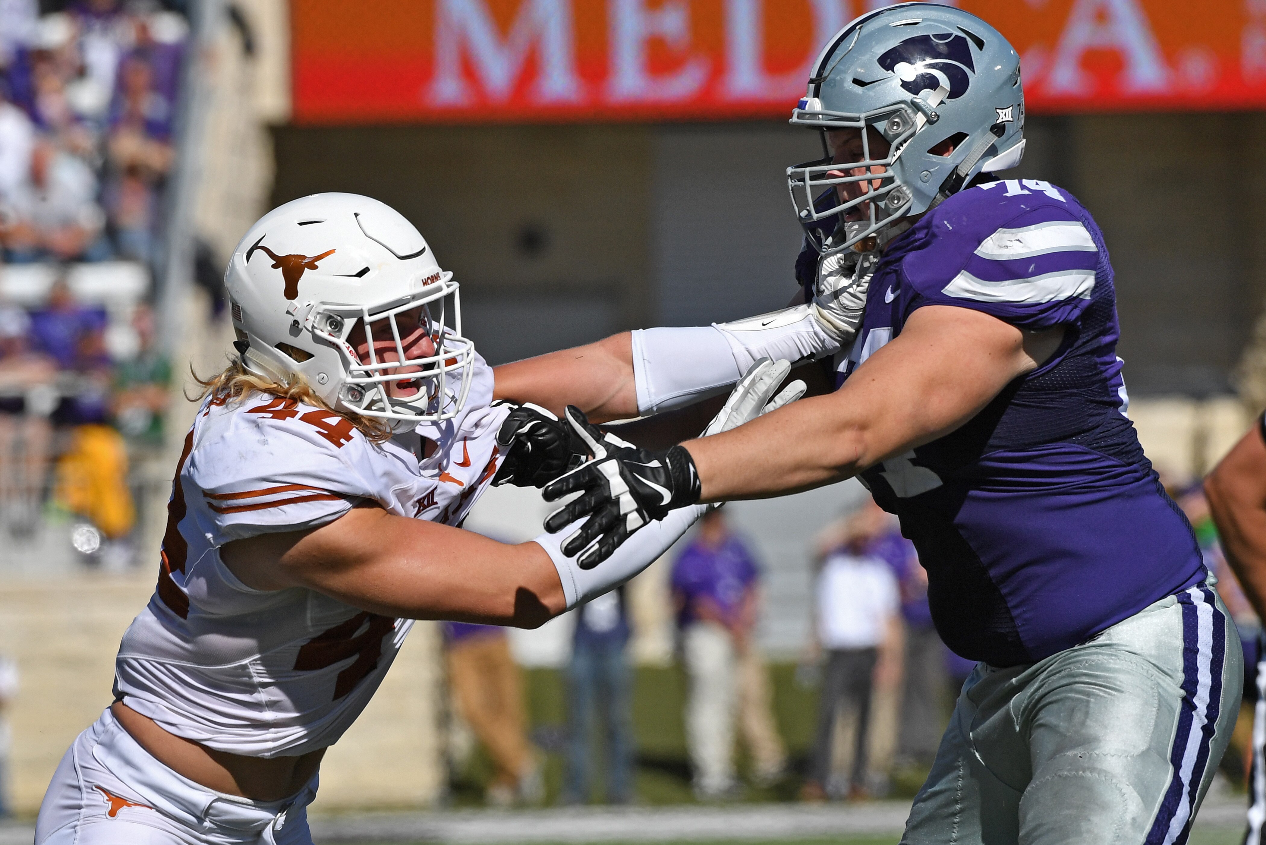 MANHATTAN, KS - OCTOBER 22:  Defensive end Breckyn Hager #44 of the Texas Longhorns battles offensive tackle Scott Frantz #74 of the Kansas State Wildcats on the line during the first half on October 22, 2016 at Bill Snyder Family Stadium in Manhattan, Kansas.  (Photo by Peter G. Aiken/Getty Images)