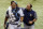 Tampa Bay Rays head athletic trainer Ron Porterfield, right, applies pressure to a cut on the head of Rays catcher Wilson Ramos who was struck by the broken bat of Baltimore Orioles' Ruben Tejada during the fifth inning of a baseball game Monday, July 24, 2017, in St. Petersburg, Fla. (AP Photo/Mike Carlson)
