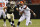 Cleveland Browns quarterback DeShone Kizer (7) runs away from New Orleans Saints defensive end Mitchell Loewen (70) during the second half of an NFL preseason football game, Thursday, Aug. 10, 2017, in Cleveland. (AP Photo/Ron Schwane)
