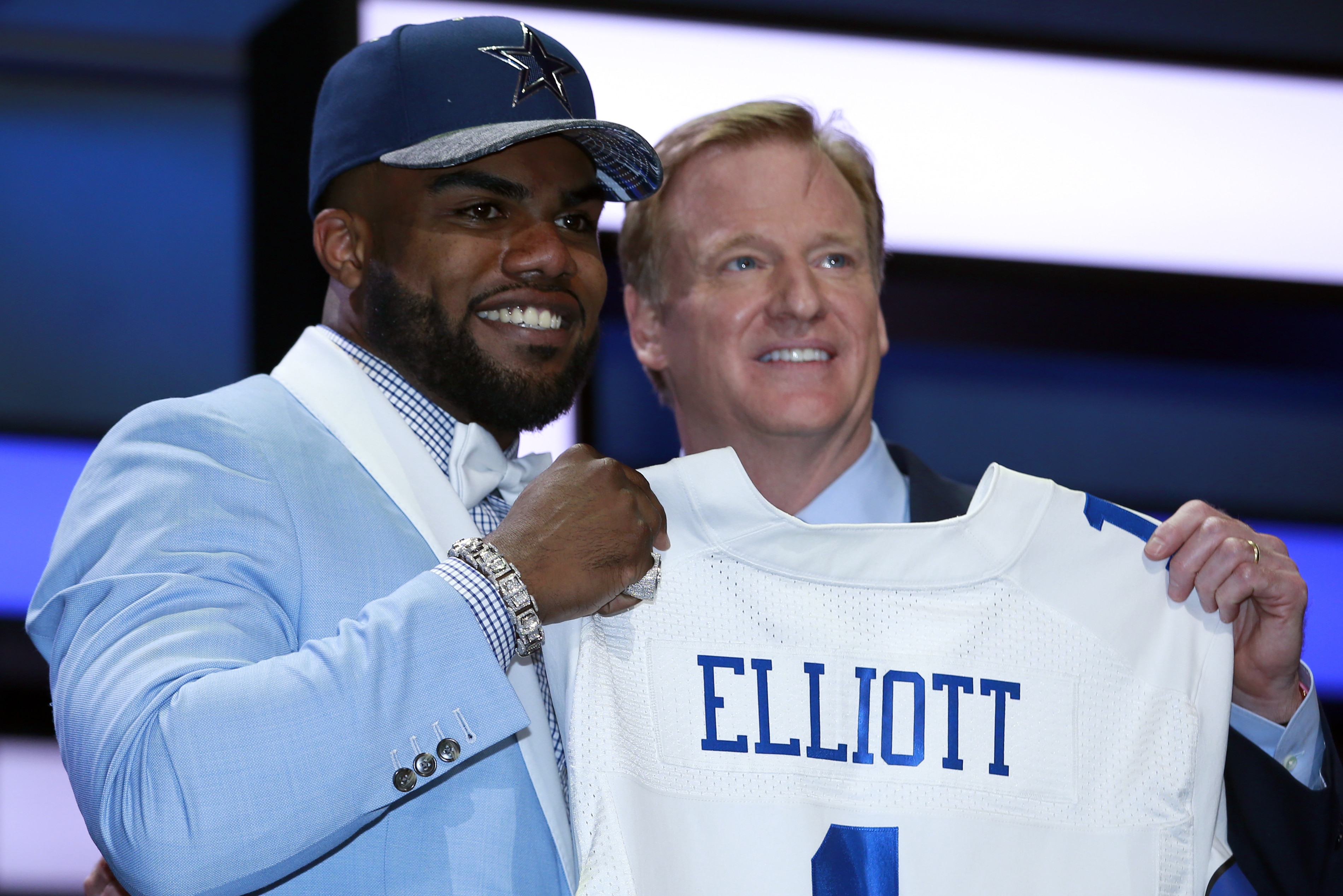Ohio State’s Ezekiel Elliott poses for photos with NFL commissioner Roger Goodell after being selected by the Dallas Cowboys as the fourth pick in the first round of the 2016 NFL football draft, Thursday, April 28, 2016, in Chicago.(Jeff Haynes/AP Images for Panini)