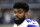 Dallas Cowboys' Ezekiel Elliott stands on the sideline in the first half of a preseason NFL football game against the Indianapolis Colts on Saturday, Aug. 19, 2017, in Arlington, Texas. (AP Photo/Ron Jenkins)