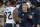 EAST RUTHERFORD, NJ - FEBRUARY 02: Head Coach Pete Carroll of the Seattle Seahawks shakes the hand of Michael Bennett #72 as Bennett walks off the field against the Denver Broncos during Super Bowl XLVIII on February 2, 2014 at MetLife Stadium in East Rutherford, New Jersey. The Seahawks won the game 43-8. (Photo by Focus on Sport/Getty Images)