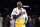 Los Angeles Lakers' Kobe Bryant pounds his chest after the last NBA basketball game of his career, against the Utah Jazz, Wednesday, April 13, 2016, in Los Angeles. (AP Photo/Jae C. Hong)