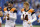 Cincinnati Bengals quarterback AJ McCarron, left, and quarterback Andy Dalton talk before a preseason NFL football game against the Indianapolis Colts in Indianapolis, Thursday, Aug. 31, 2017. (AP Photo/Michael Conroy)