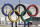 FILE - In this April 4, 2017, file photo, Olympic rings are seen in front of Gangneung Hockey Center in Gangneung, South Korea. With five months to go before the opening ceremony of the Pyeongchang Winter Olympics, organizers are desperate to sell more tickets in a country where the Games have failed to dominate national conversation amid an upheaval in domestic politics and a torrent of North Korean missile launches. (AP Photo/Ahn Young-joon, File)