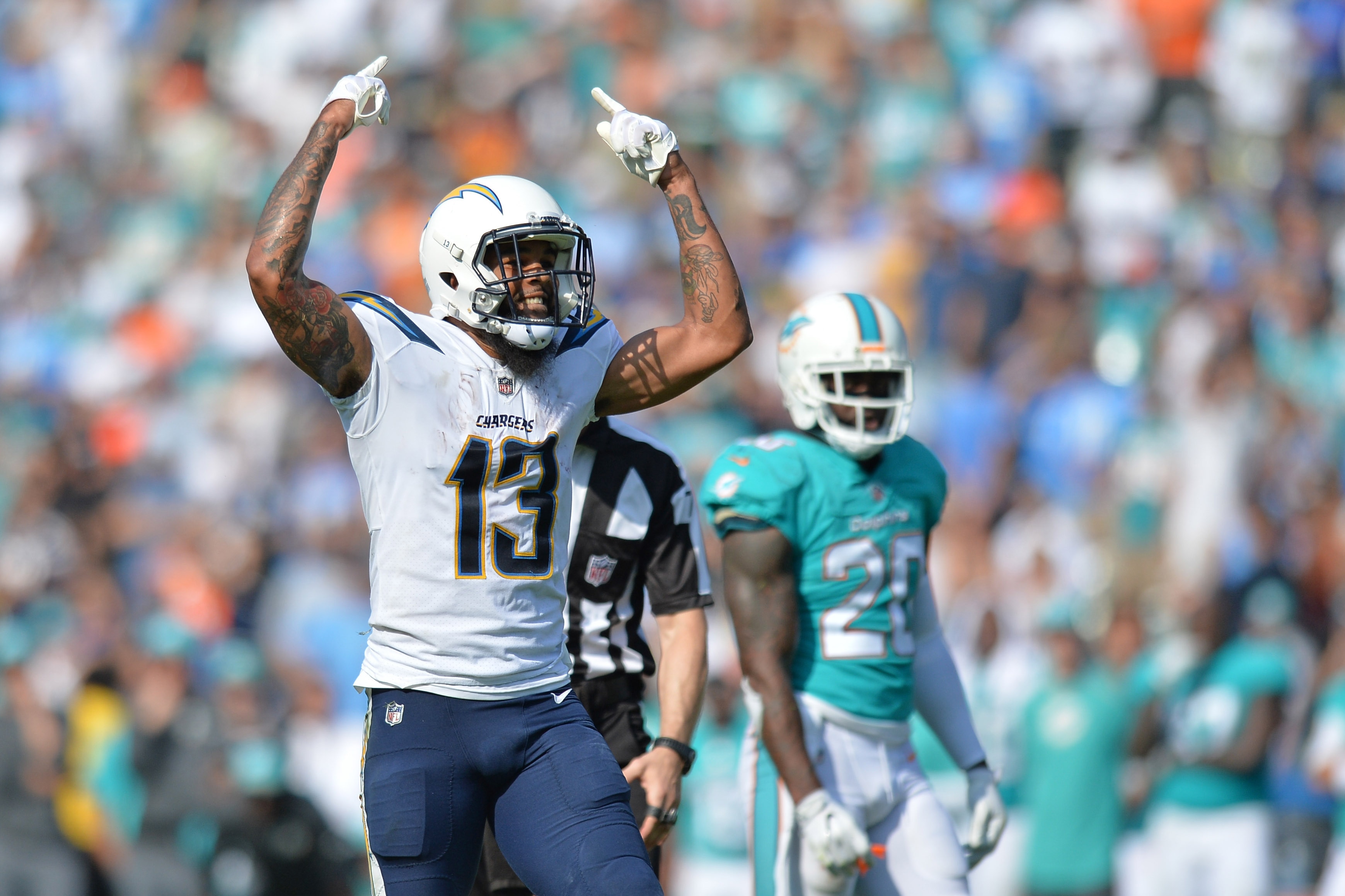 Sep 17, 2017; Carson, CA, USA; Los Angeles Chargers wide receiver Keenan Allen (13) reacts during the fourth quarter as Miami Dolphins free safety Reshad Jones (20) looks on at StubHub Center. Mandatory Credit: Jake Roth-USA TODAY Sports