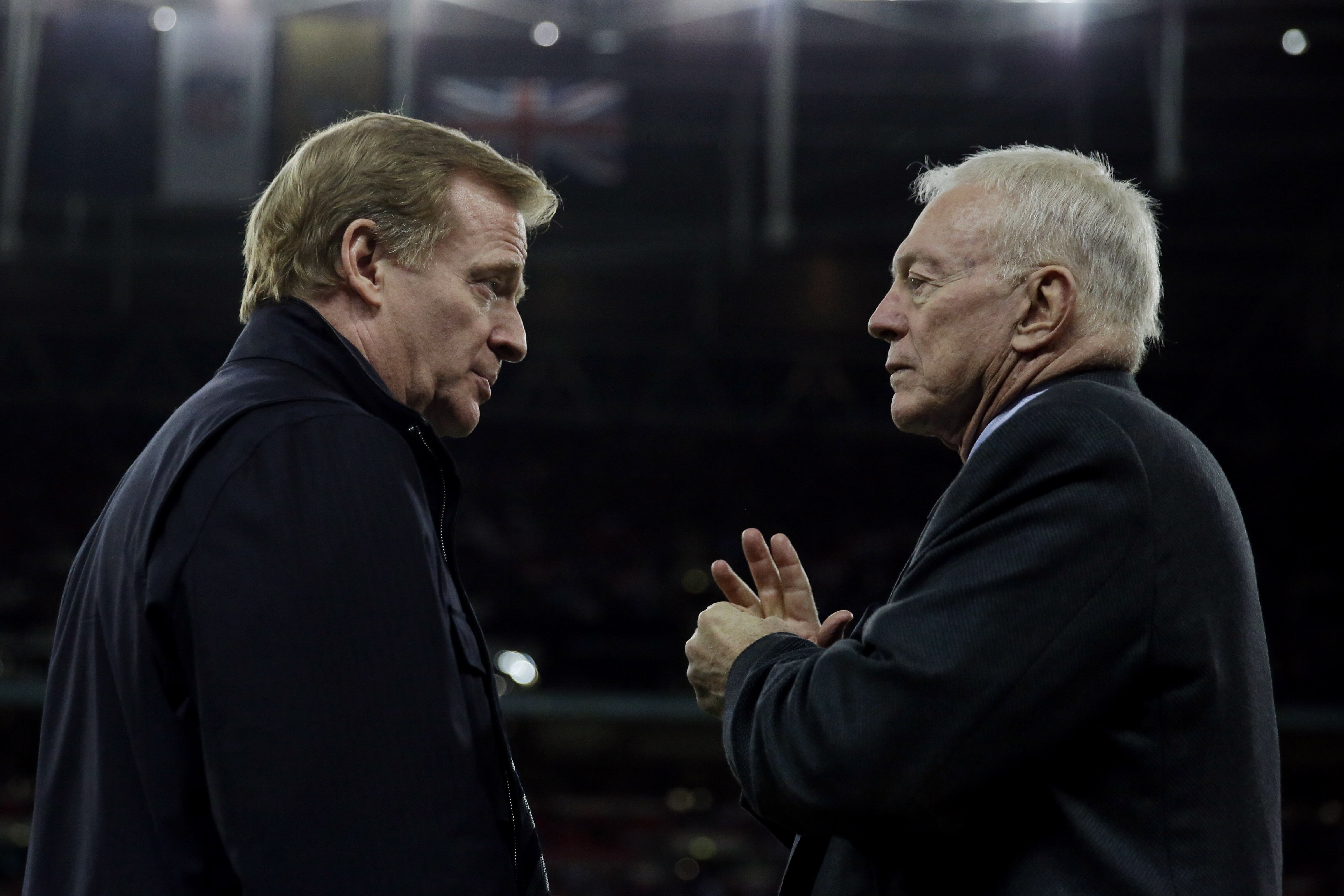 NFL commissioner Roger Goodell, left and Dallas Cowboys owner Jerry Jones talk during the NFL football game between the Jacksonville Jaguars and the Dallas Cowboys at Wembley Stadium, London, Sunday, Nov. 9, 2014. (AP Photo/Matt Dunham)