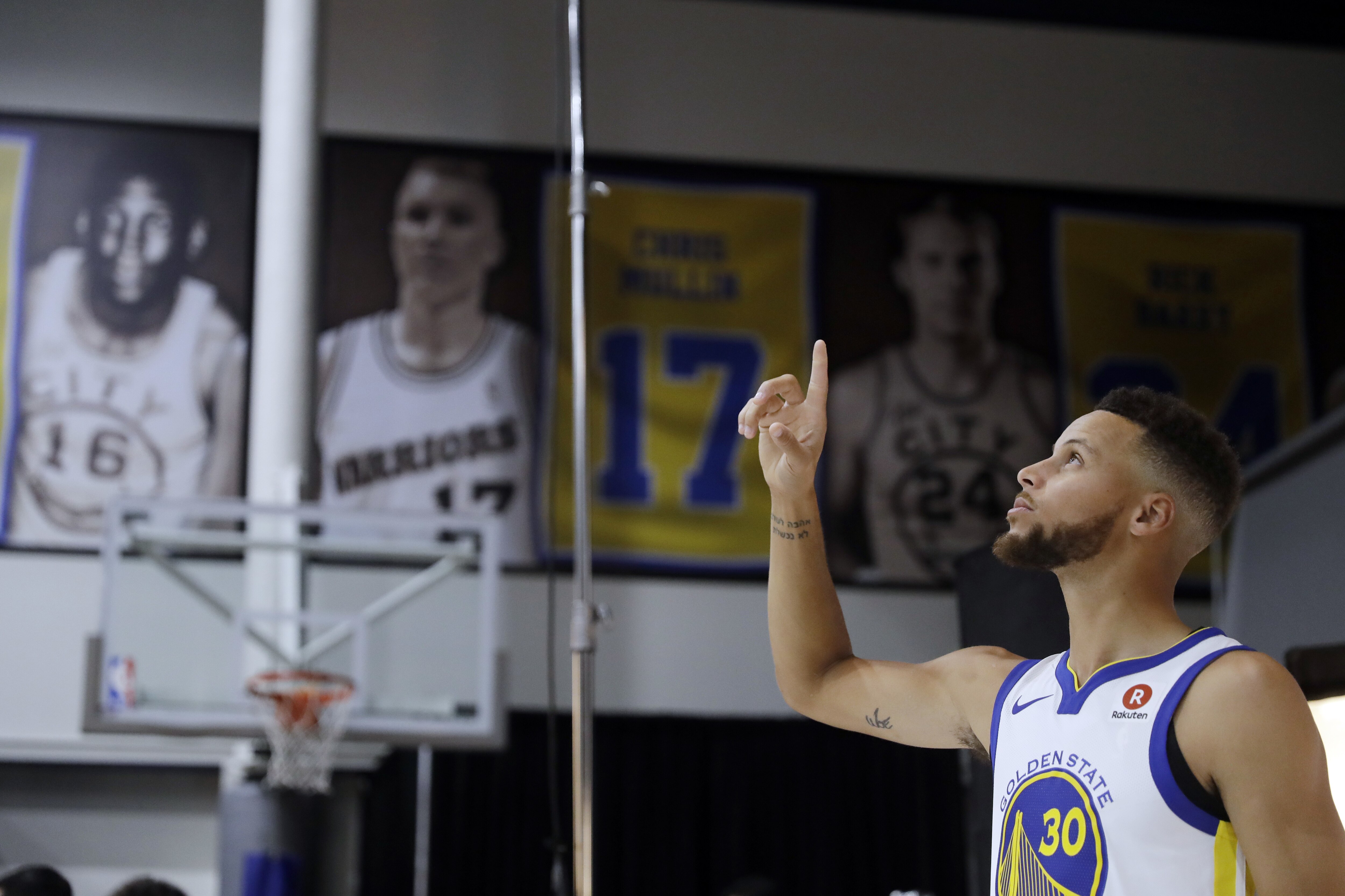 Golden State Warriors' Stephen Curry poses for photos during NBA basketball team media day Friday, Sept. 22, 2017, in Oakland, Calif. (AP Photo/Marcio Jose Sanchez)