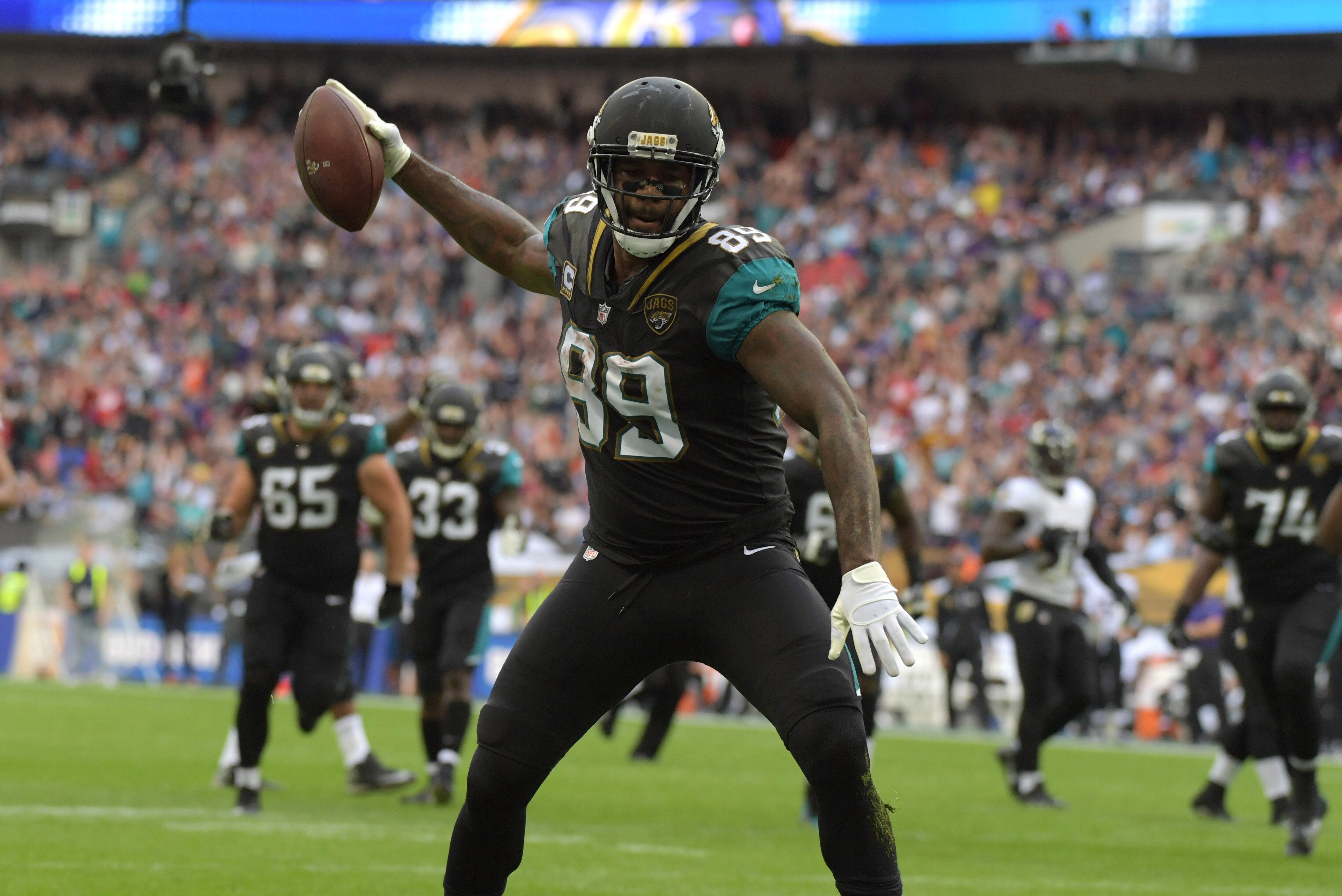 Sep 24, 2017; London, United Kingdom; Jacksonville Jaguars tight end Marcedes Lewis (89) spikes the ball after scoring on a 17-yard touchdown pass in the first quarter against the Baltimore Ravens during the NFL International Series game at Wembley Stadium. Mandatory Credit: Kirby Lee-USA TODAY Sports