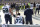 Seattle Seahawks' Michael Bennett remains seated on the bench during the national anthem before an NFL football game against the Green Bay Packers Sunday, Sept. 10, 2017, in Green Bay, Wis. (AP Photo/Jeffrey Phelps)