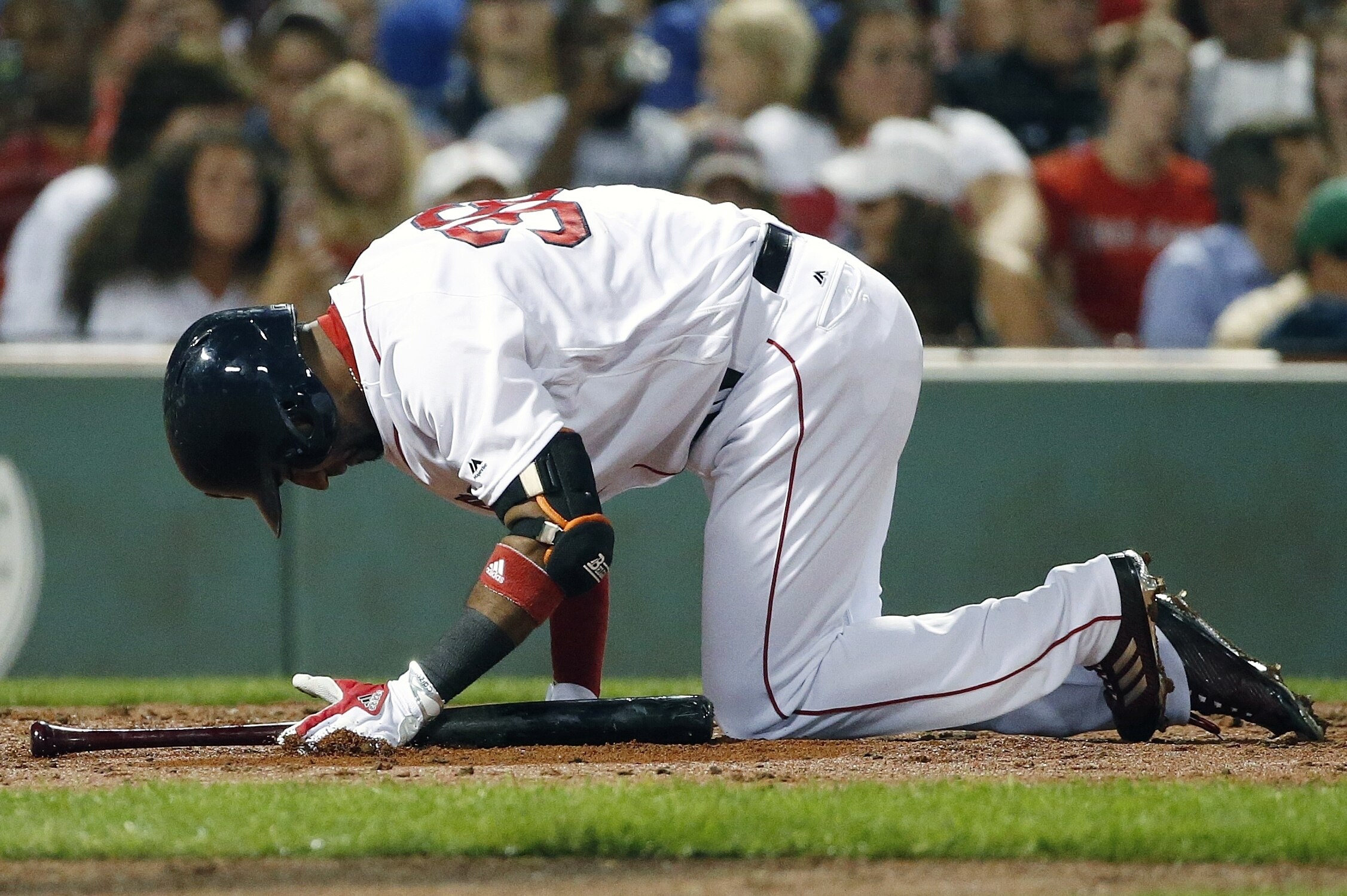 Boston Red Sox's Eduardo Nunez kneels on the ground after fouling off during the third inning of a baseball game against the Toronto Blue Jays in Boston, Monday, Sept. 25, 2017. (AP Photo/Michael Dwyer)