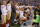 Member of the San Francisco 49ers kneel during the playing of the national anthem before an NFL football game against the Indianapolis Colts, Sunday, Oct. 8, 2017, in Indianapolis. (AP Photo/Michael Conroy)