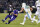 Baltimore Ravens quarterback Joe Flacco, left, slides onto the field in front of Miami Dolphins middle linebacker Kiko Alonso in the first half of an NFL football game, Thursday, Oct. 26, 2017, in Baltimore. (AP Photo/Nick Wass)