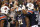 Auburn running back Kerryon Johnson, center, is congratulated after scoring a touchdown during the second half of an NCAA college football game against Georgia, Saturday, Nov. 11, 2017, in Auburn, Ala. Auburn won 40-17. (AP Photo/Brynn Anderson)