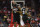 HOUSTON, TX - NOVEMBER 27:  James Harden #13 of the Houston Rockets looks at the scoreboard as he runs down the court after a three point shot in the first half against the Brooklyn Nets at Toyota Center on November 27, 2017 in Houston, Texas.  NOTE TO USER: User expressly acknowledges and agrees that, by downloading and or using this photograph, User is consenting to the terms and conditions of the Getty Images License Agreement.  (Photo by Tim Warner/Getty Images)