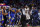 Golden State Warriors forward Kevin Durant and New Orleans Pelicans center DeMarcus Cousins (0) are restrained while going after each other during a scuffle in the second half of an NBA basketball game in New Orleans, Monday, Dec. 4, 2017. Both players were ejected from the game. (AP Photo/Gerald Herbert)