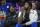 Oklahoma City Thunder's Paul George, right, looks on from the bench with Carmelo Anthony, left, during the first half of an NBA basketball game against the Philadelphia 76ers, Friday, Dec. 15, 2017, in Philadelphia. The Thunder won 119-117 in triple overtime. (AP Photo/Chris Szagola)