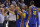 Referee Scott Wall, left, calls Golden State Warriors guard Stephen Curry (30) for a foul as Curry and Warriors forwards Andre Iguodala (9), and Kevin Durant (35) react during the second half of an NBA basketball game Saturday, Oct. 21, 2017, in Memphis, Tenn. Curry and Durant were ejected after arguing with Wall over the call. (AP Photo/Brandon Dill)