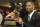 FILE - In this Dec. 13, 1997, file photo, Michigan's Charles Woodson poses with the Heisman Trophy after becoming the first primarily defensive player ever to take the honor at the Downtown Athletic Club  in New York. Tyrann Mathieu's play for top-ranked LSU has spawned a grass roots Heisman Trophy campaign by LSU fans that includes a Tyrann Mathieu for Heisman Facebook page. His chances of joining Woodson to become the second defense-first player in the modern era of football to win the Heisman are probably pretty slim. (AP Photo/Adam Nadel, File)